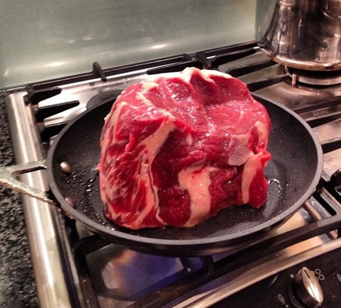 A big load of meat steak in a frying pan